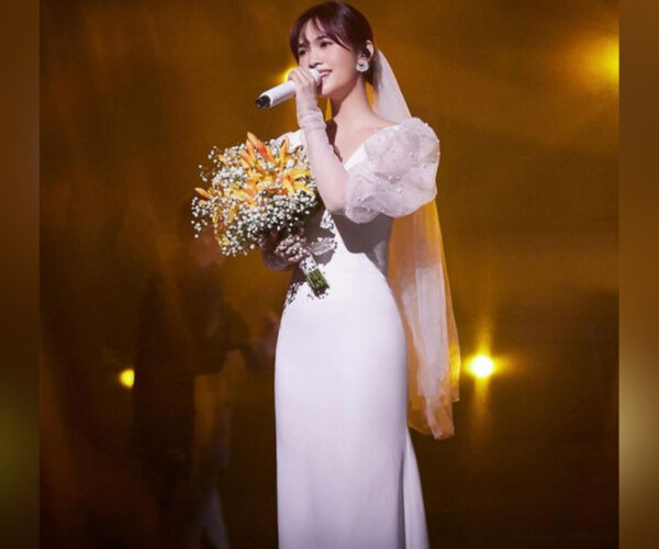 Rainie Yang stuns in wedding dress for a performance